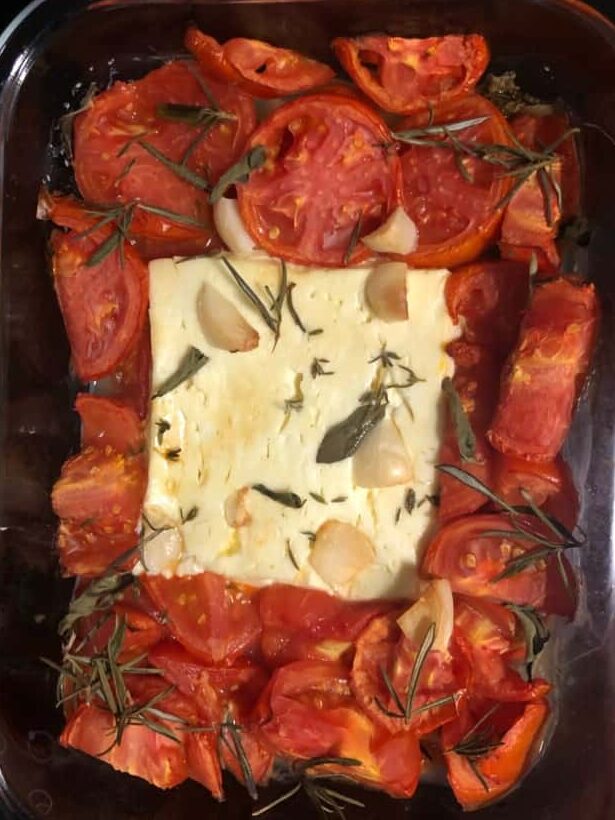 Freshly baked feta, tomato and herbs